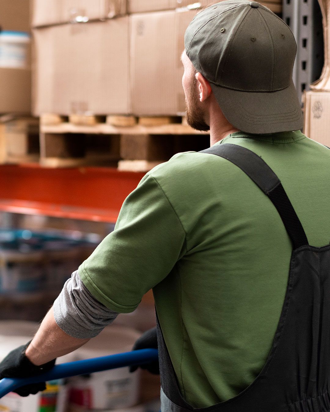 Worker moving boxes in a warehouse